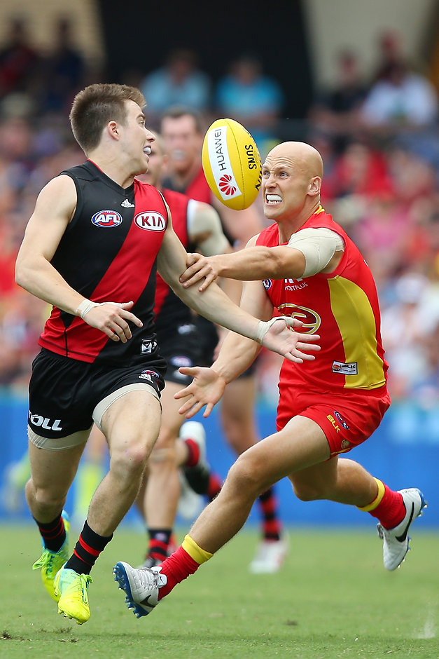 AFL 2016 Rd 01 - Gold Coast v Essendon Zach Merrett and Gary Ablett contest the ball at Metricon Stadium during the Suns' big win - ${keywords}